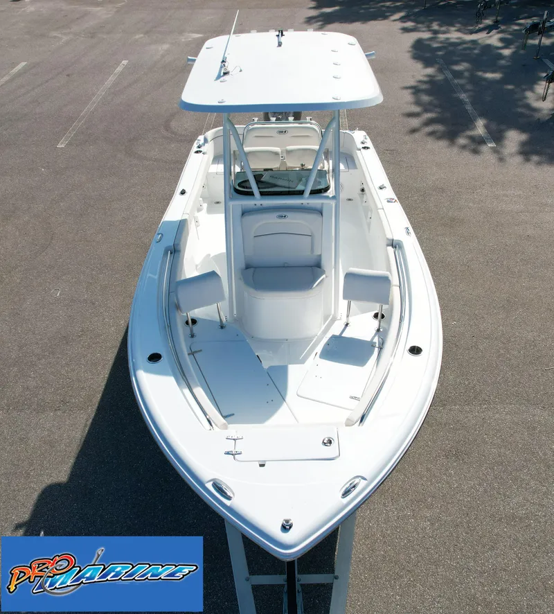 Slide: The Image of 2025 Sea Hunt Ultra 219 boat, aerial view, white hull, spacious deck. - 16