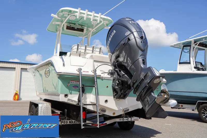 Slide: The Image of 2025 Sea Hunt Ultra 219 boat with Yamaha outboard motor on trailer. - 26