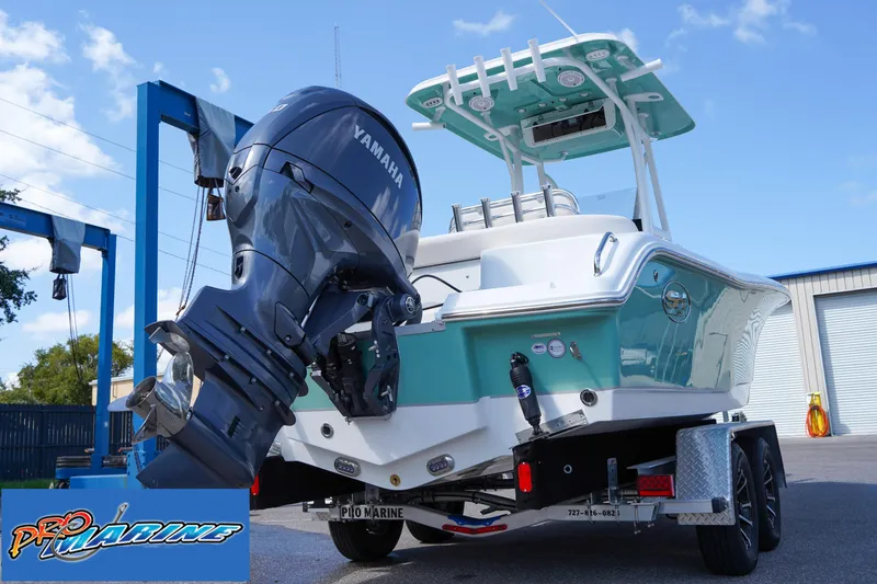 Slide: The Image of 2025 Sea Hunt Ultra 219 boat with Yamaha outboard motor on trailer. - 29