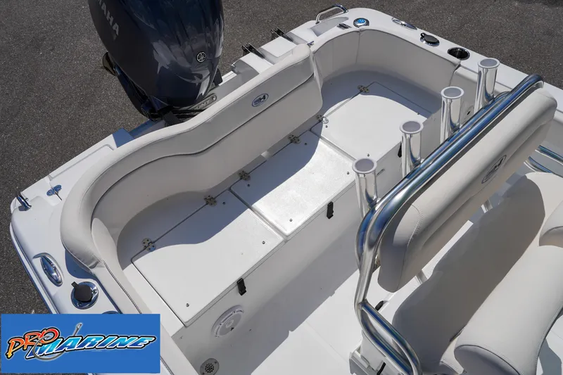 Slide: The Image of 2025 Sea Hunt Ultra 219 boat interior with seating and rod holders. - 40