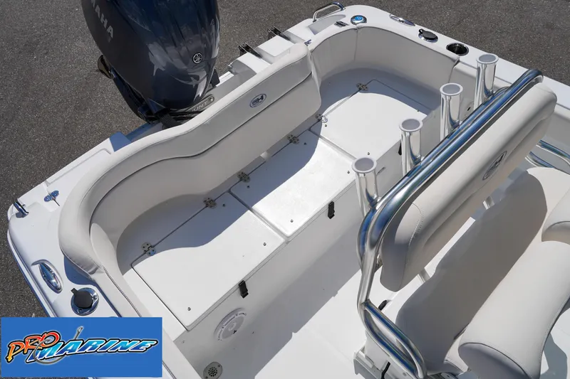 Slide: The Image of 2025 Sea Hunt Ultra 219 boat interior with seating and rod holders. - 41