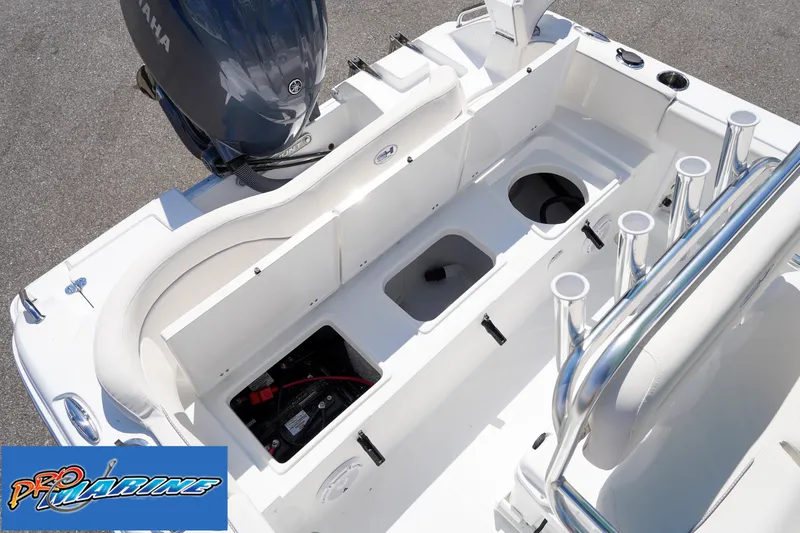 Slide: The Image of 2025 Sea Hunt Ultra 219 boat interior with Yamaha engine and storage compartments. - 42