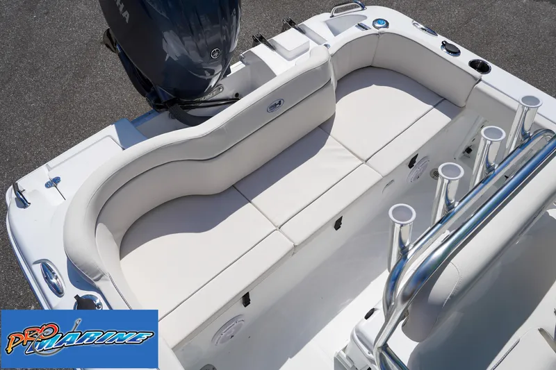 Slide: The Image of 2025 Sea Hunt Ultra 219 boat interior with seating and rod holders. - 43