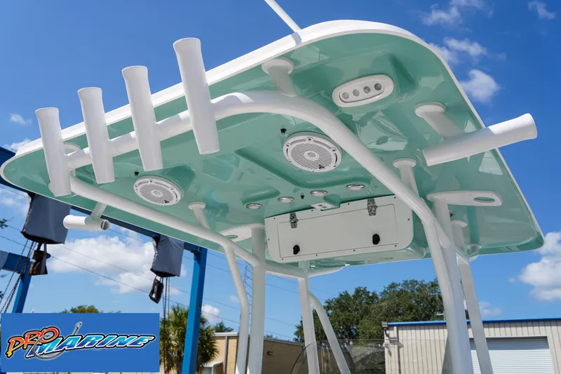 Slide: The Image of 2025 Sea Hunt Ultra 219 boat T-top with rod holders and speakers. - 46