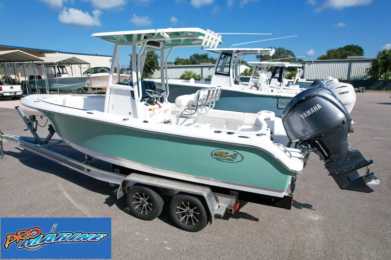 Slide: The Image of 2025 Sea Hunt Ultra 219 boat with Yamaha engine on trailer at Pro Marine dealership. - 6