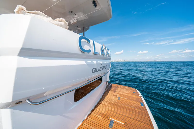Slide: The Image of Azimut Magellano 66 yacht, 2018 model, on open sea with wooden deck. - 10