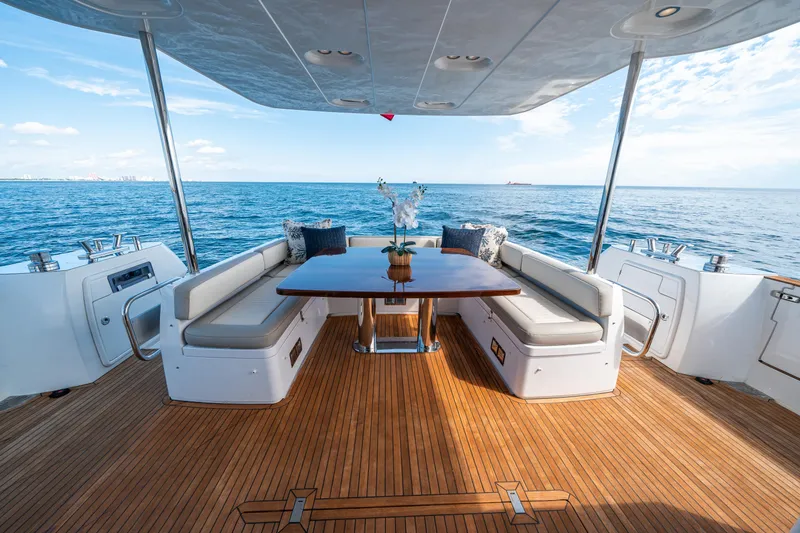 Slide: The Image of Luxurious 2018 Azimut Magellano 66 yacht deck with ocean view and elegant seating. - 13