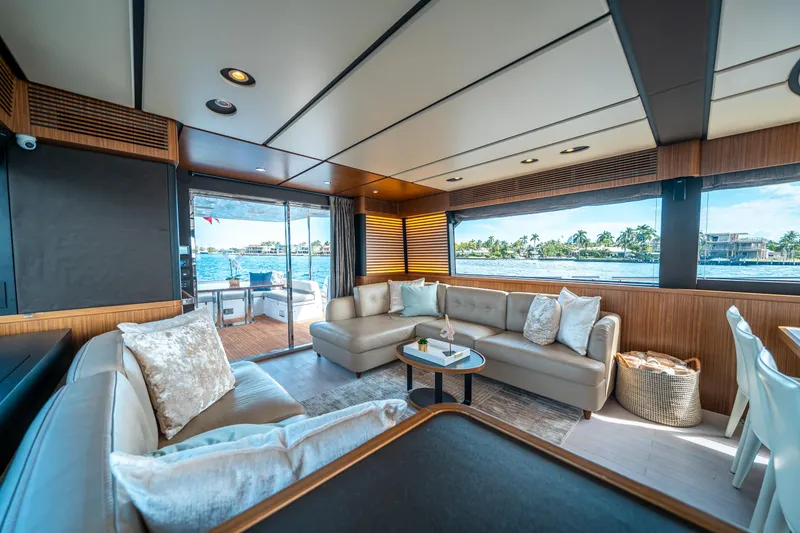 Slide: The Image of Luxurious interior of 2018 Azimut Magellano 66 yacht with elegant seating and scenic views. - 18