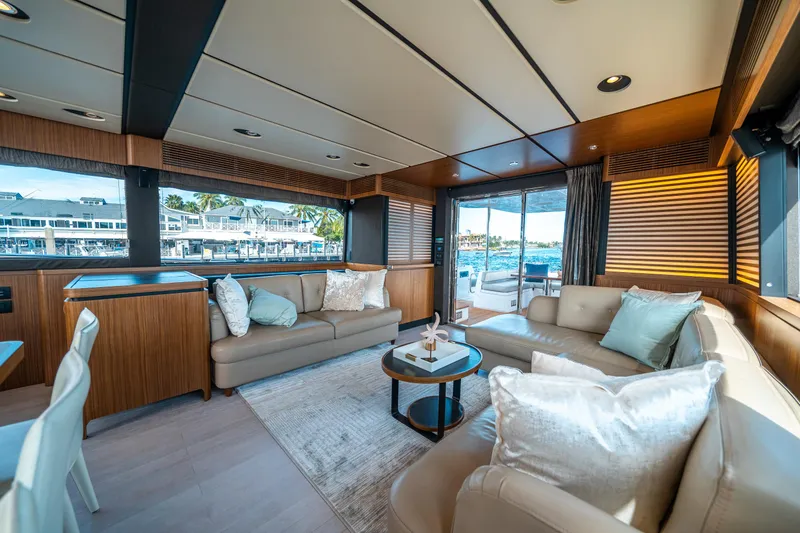 Slide: The Image of Luxurious interior of 2018 Azimut Magellano 66 yacht with elegant seating and scenic views. - 19