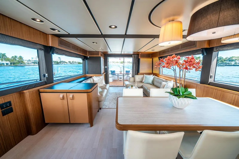 Slide: The Image of Luxurious interior of 2018 Azimut Magellano 66 yacht with elegant furnishings and panoramic windows. - 21