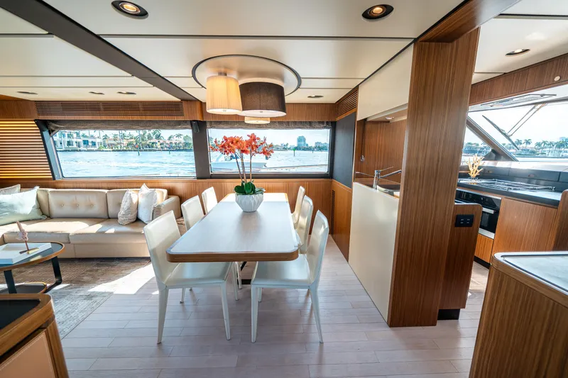 Slide: The Image of Luxurious interior of 2018 Azimut Magellano 66 yacht with dining area and scenic views. - 22
