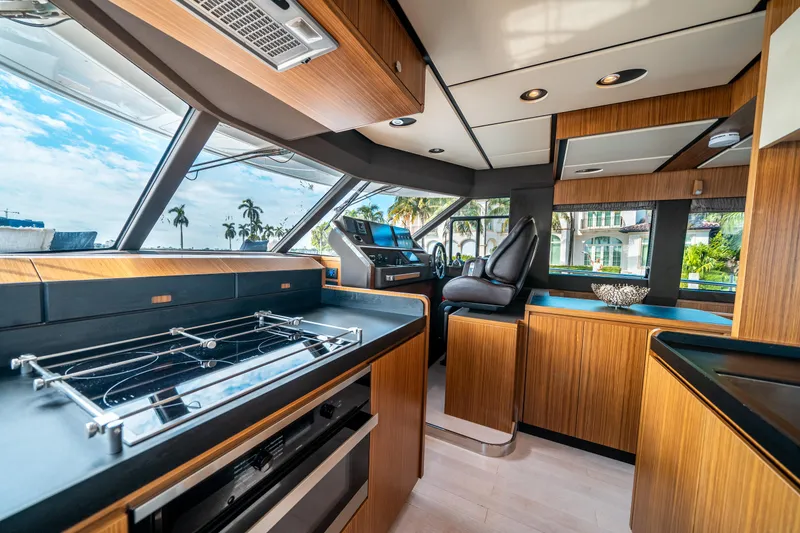 Slide: The Image of Luxurious interior of 2018 Azimut Magellano 66 yacht with modern kitchen and helm. - 24