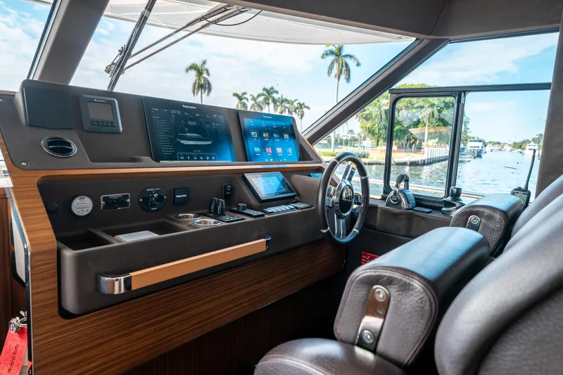 Slide: The Image of Interior helm of 2018 Azimut Magellano 66 yacht with modern navigation equipment. - 25