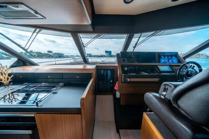 Slide: The Image of Luxurious interior of 2018 Azimut Magellano 66 yacht with modern navigation controls. - 26