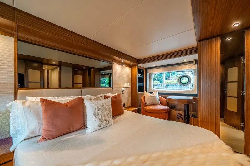 Slide: The Image of Luxurious bedroom interior of 2018 Azimut Magellano 66 yacht with elegant wood finishes. - 30