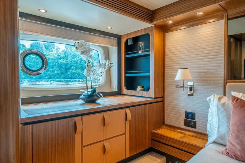 Slide: The Image of Luxurious interior of 2018 Azimut Magellano 66 yacht with elegant wood finishes and decor. - 31