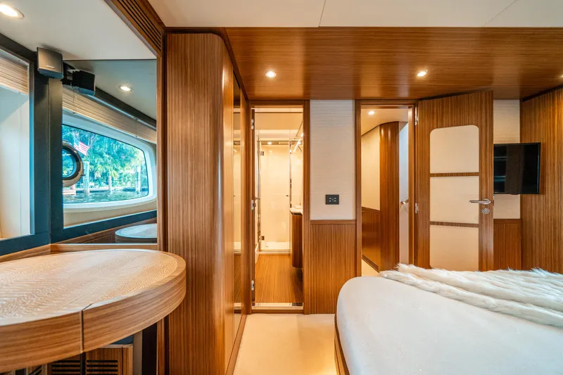 Slide: The Image of Luxurious interior of 2018 Azimut Magellano 66 yacht with wood finishes and modern design. - 33