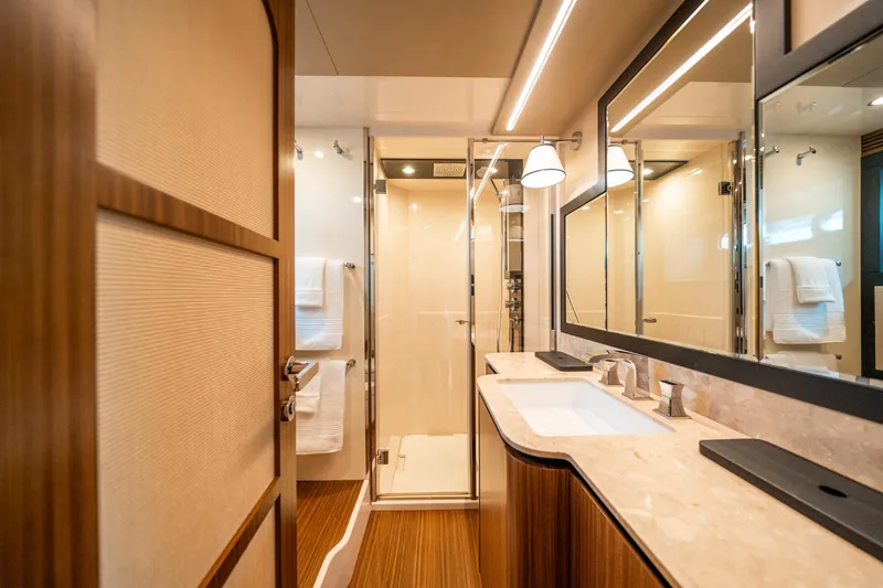 Slide: The Image of Luxurious bathroom interior of 2018 Azimut Magellano 66 yacht with modern fixtures. - 34
