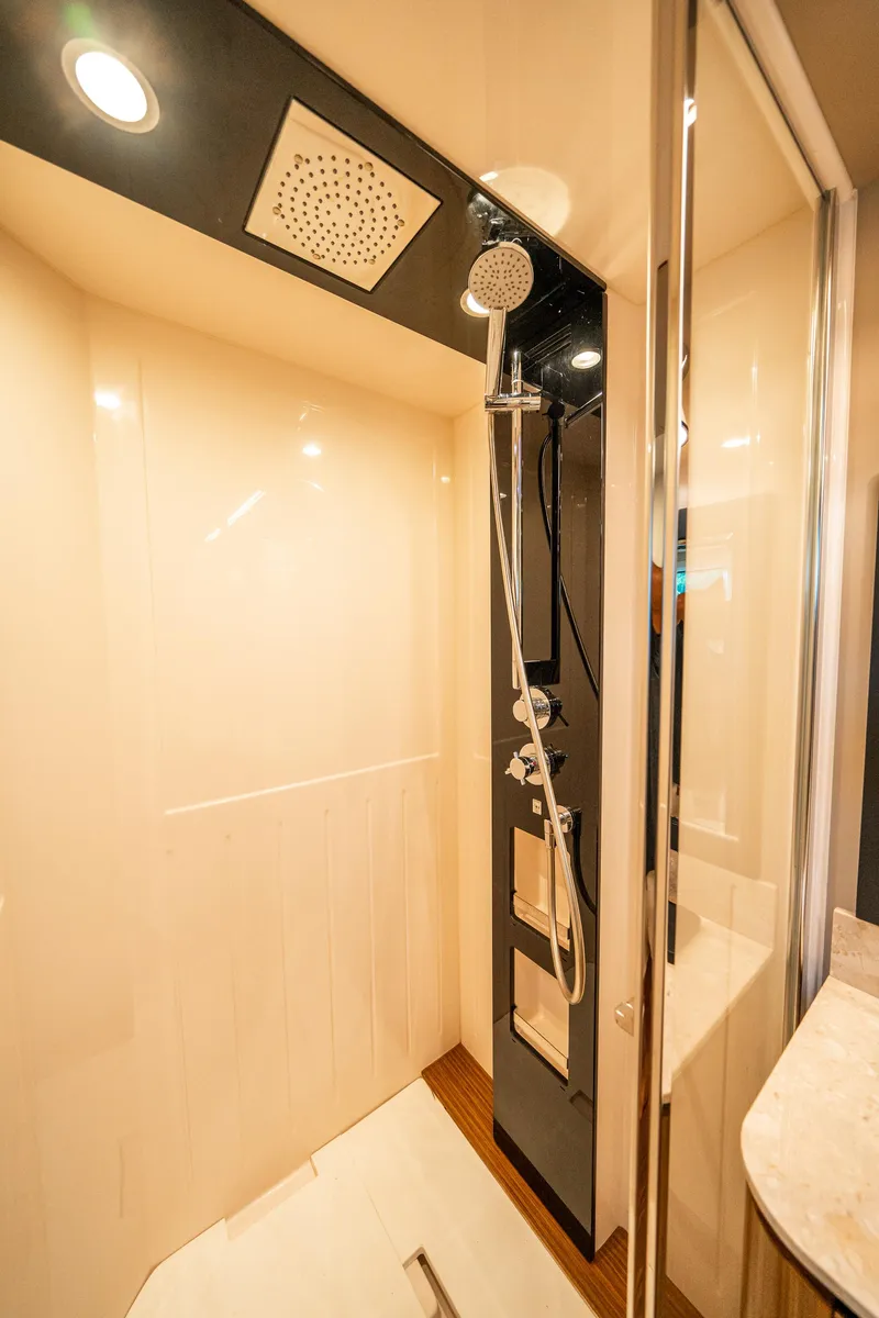 Slide: The Image of Luxurious shower in 2018 Azimut Magellano 66 yacht, featuring modern fixtures and elegant design. - 36