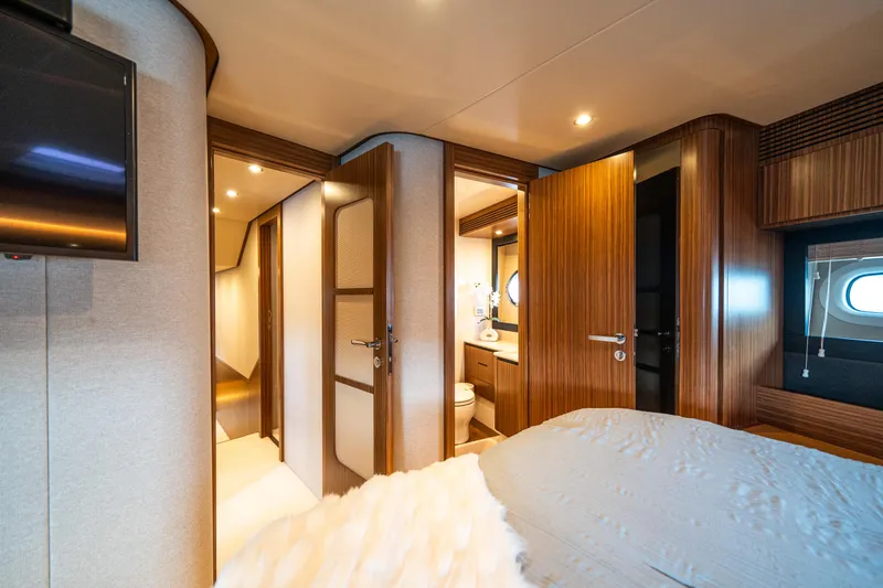 Slide: The Image of Luxurious interior of 2018 Azimut Magellano 66 yacht cabin with wood finishes. - 39