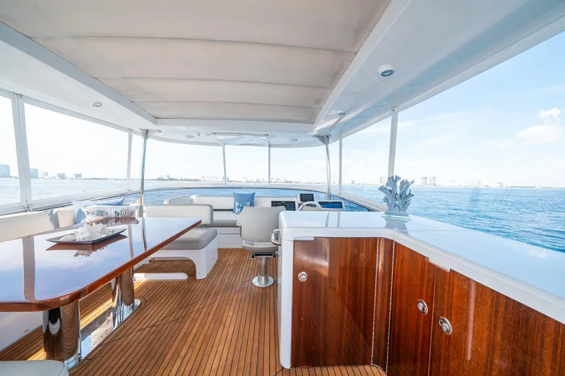 Slide: The Image of Luxurious 2018 Azimut Magellano 66 yacht interior with elegant wood finishes and ocean view. - 47