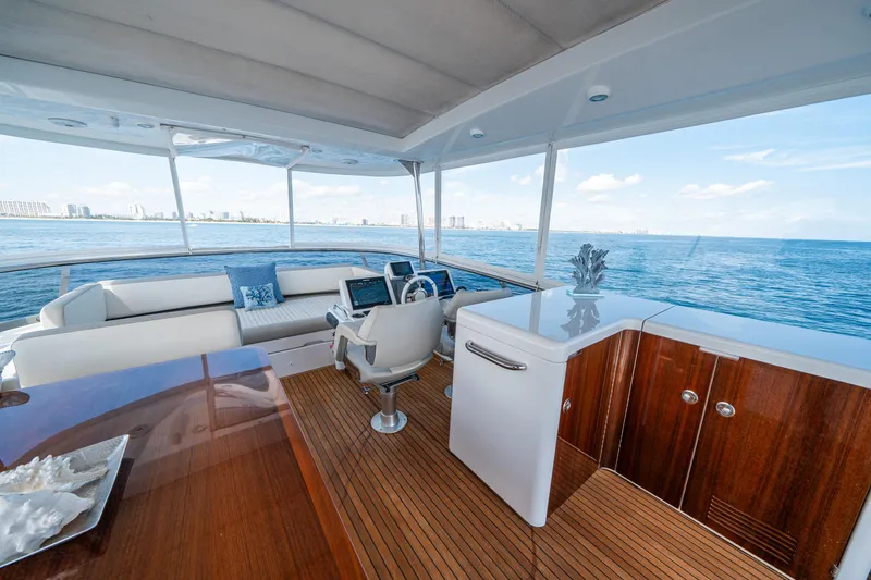 Slide: The Image of Luxurious 2018 Azimut Magellano 66 yacht interior with ocean view and elegant furnishings. - 49