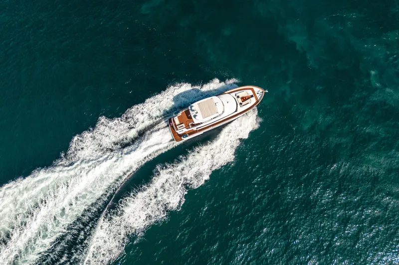Slide: The Image of Aerial view of 2018 Azimut Magellano 66 yacht cruising on open water. - 8