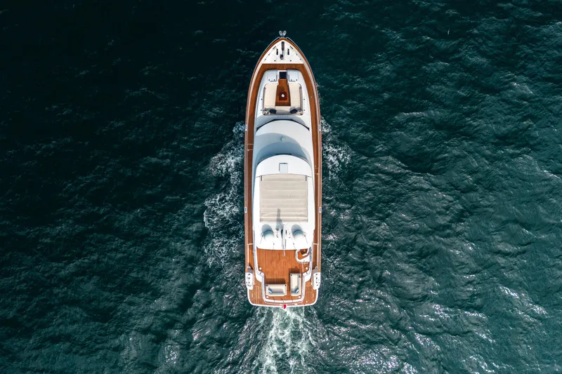 Slide: The Image of Aerial view of 2018 Azimut Magellano 66 yacht cruising on open water. - 9