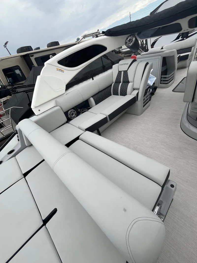 Slide: The Image of 2025 Harris Grand Mariner SL 250 luxury boat interior with sleek seating and modern design. - 10