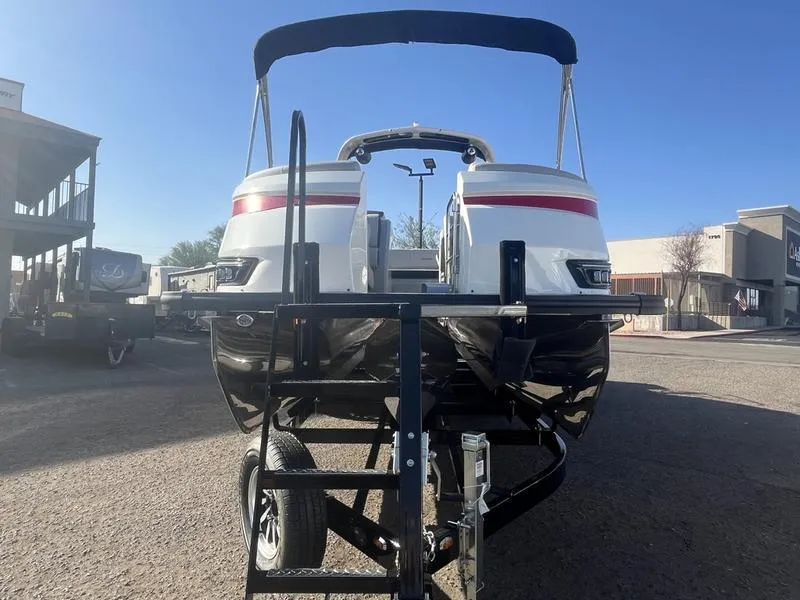 Slide: The Image of 2025 Harris Grand Mariner SL 250 pontoon boat on trailer, rear view, sunny day. - 4