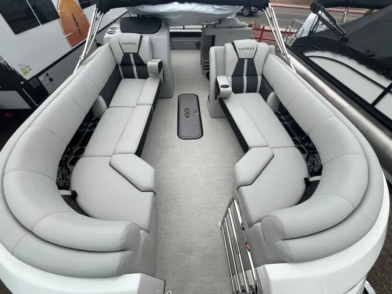 Slide: The Image of 2025 Harris Grand Mariner SL 250 pontoon boat with spacious seating and modern design. - 6