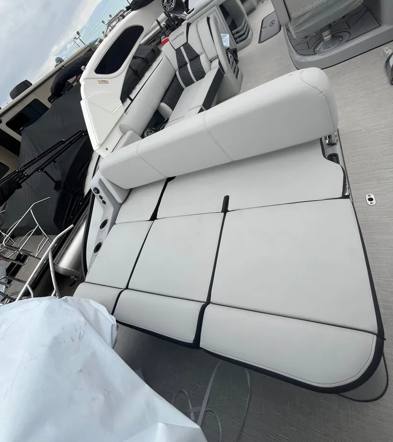 Slide: The Image of 2025 Harris Grand Mariner SL 250 boat interior with sleek seating and modern design. - 9