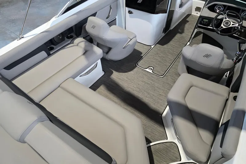 Slide: The Image of 2025 Four Winns HD3 boat interior with gray seating and modern dashboard. - 12