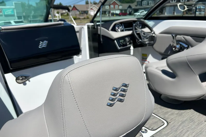Slide: The Image of 2025 Four Winns HD3 boat interior with sleek design and modern dashboard. - 15