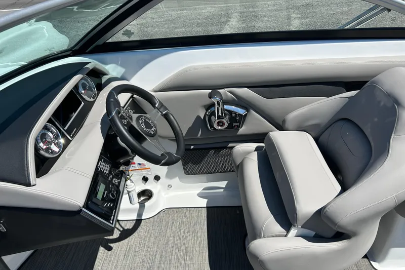 Slide: The Image of 2025 Four Winns HD3 boat cockpit with modern steering and controls. - 18