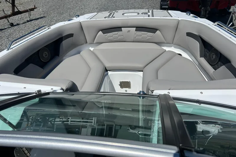 Slide: The Image of 2025 Four Winns HD3 boat interior with gray seating and modern design. - 22