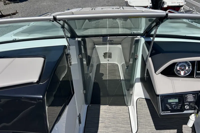 Slide: The Image of 2025 Four Winns HD3 boat interior with sleek design and modern dashboard features. - 23