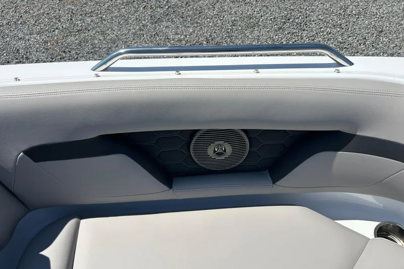 Slide: The Image of 2025 Four Winns HD3 boat interior with cushioned seating and integrated speaker. - 26