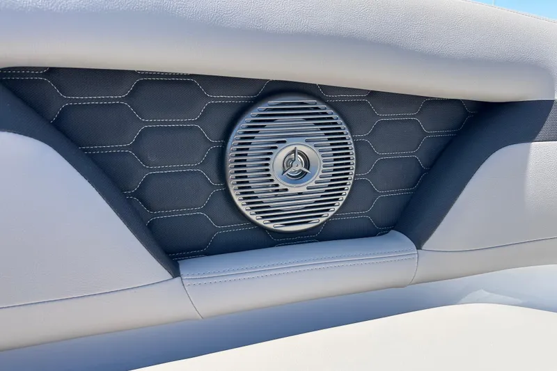 Slide: The Image of 2025 Four Winns HD3 boat interior with stylish speaker and hexagonal pattern design. - 27