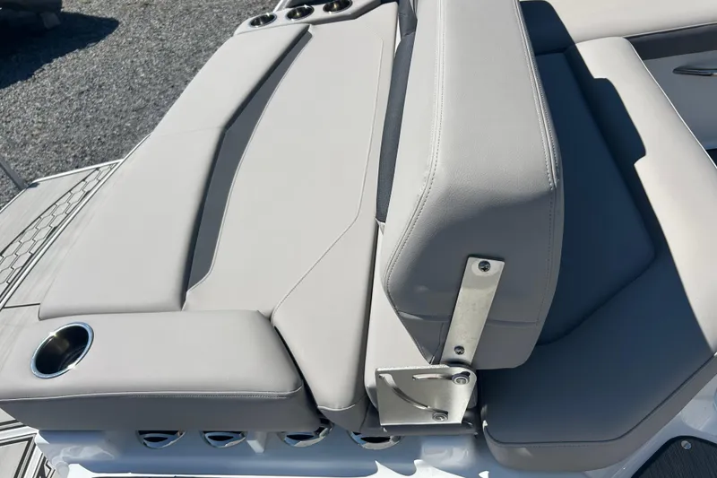 Slide: The Image of 2025 Four Winns HD3 boat seating with cup holders and adjustable backrest. - 37