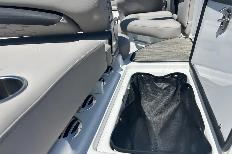 Slide: The Image of 2025 Four Winns HD3 boat interior with seating and storage compartment. - 40