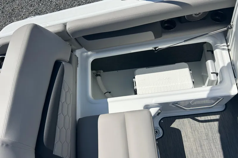Slide: The Image of 2025 Four Winns HD3 boat interior storage compartment with cooler and seating. - 41