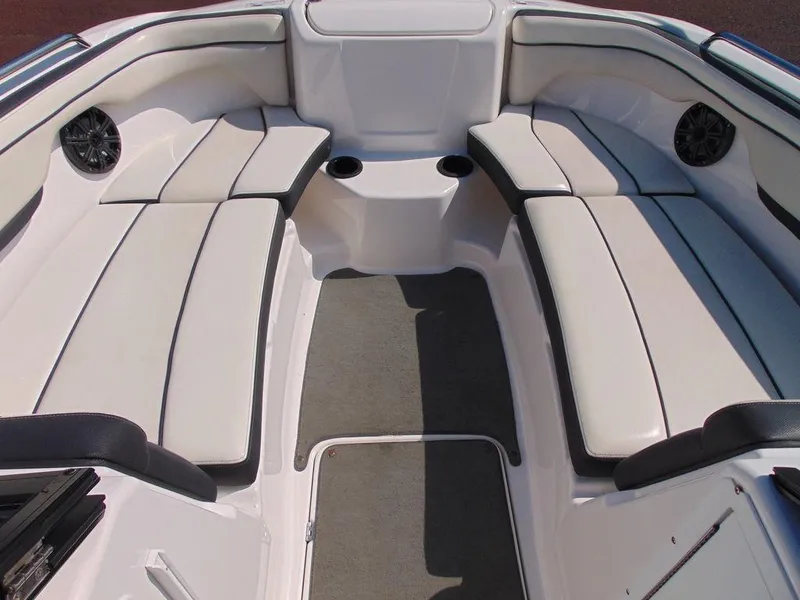 Slide: The Image of 2017 Yamaha AR210 boat interior with cushioned seating and cup holders. - 10
