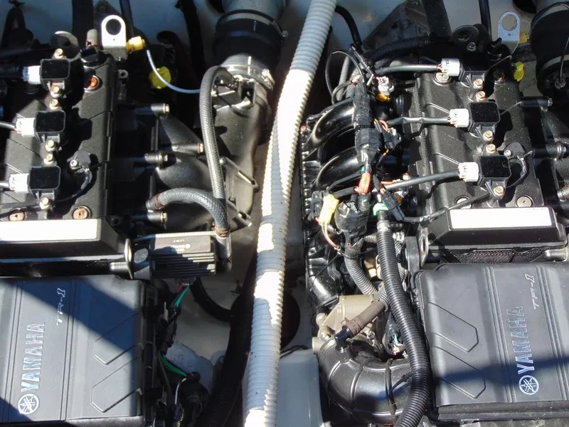 Slide: The Image of 2017 Yamaha AR210 boat engine components, showcasing intricate mechanical details and wiring. - 12