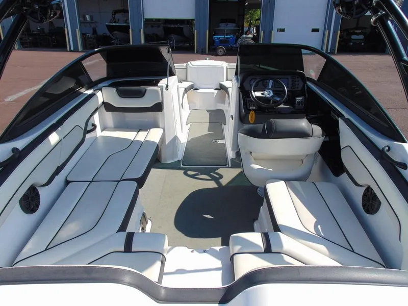 Slide: The Image of 2017 Yamaha AR210 boat interior with spacious seating and modern dashboard. - 7