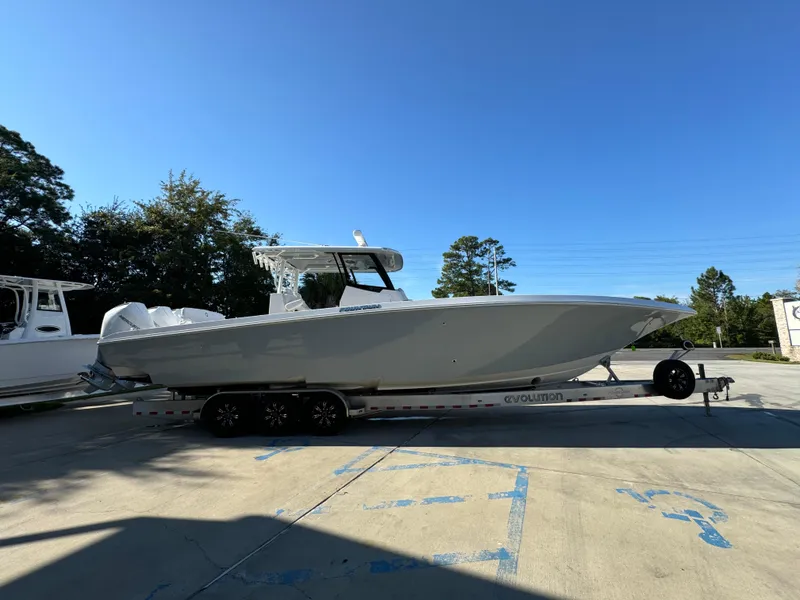 Slide: The Image of 2025 Fountain 38TE boat on trailer in sunny outdoor setting. - 10