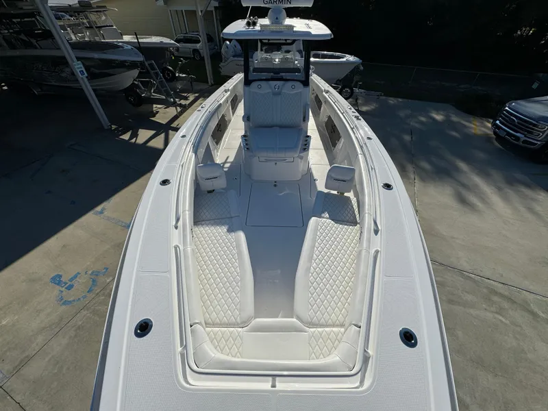Slide: The Image of 2025 Fountain 38TE boat with sleek white design and spacious deck layout. - 21