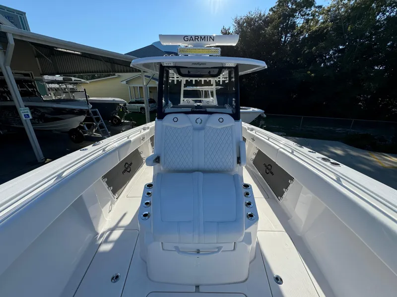 Slide: The Image of 2025 Fountain 38TE boat with Garmin equipment, docked under clear skies. - 23