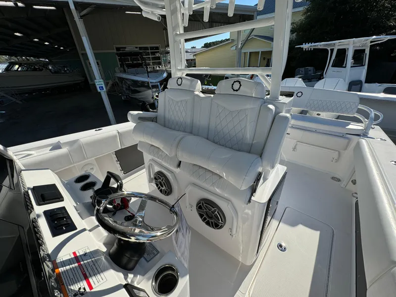 Slide: The Image of 2025 Fountain 38TE boat interior with white seating and modern steering console. - 27
