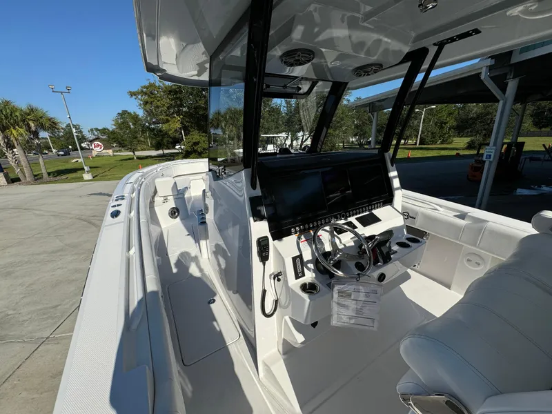 Slide: The Image of 2025 Fountain 38TE boat interior with modern dashboard and seating. - 28